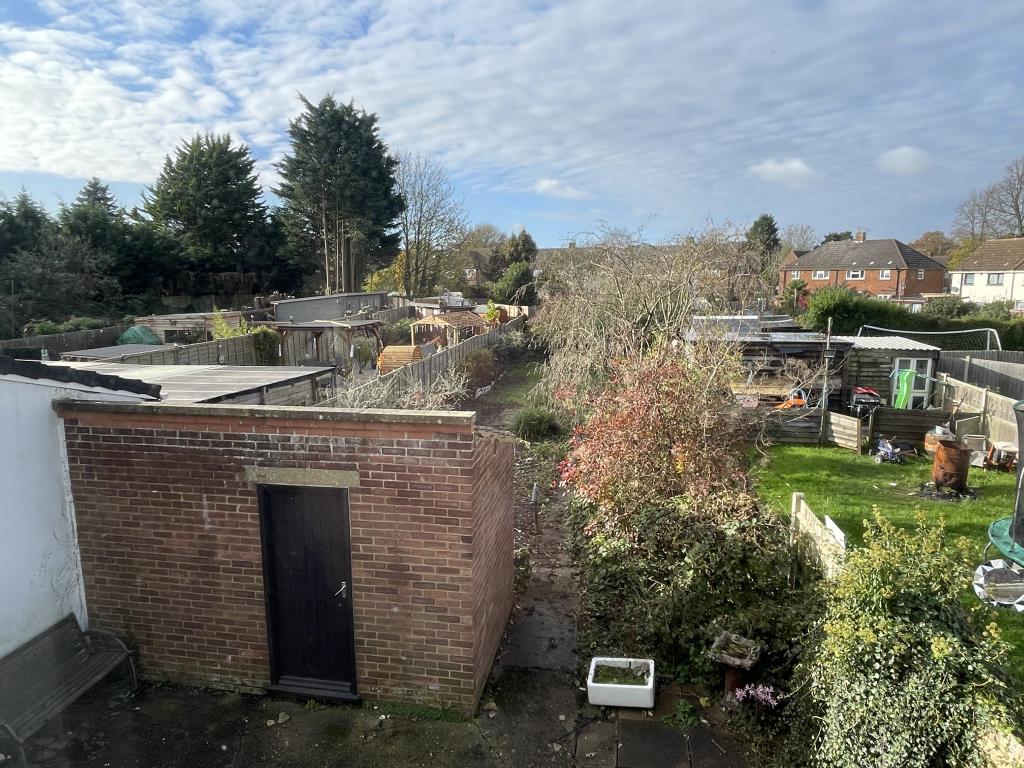 Lot: 122 - SEMI-DETACHED HOUSE IN NEED OF IMPROVEMENT IN POPULAR VILLAGE - view across rear garden in village semi in need of improvement